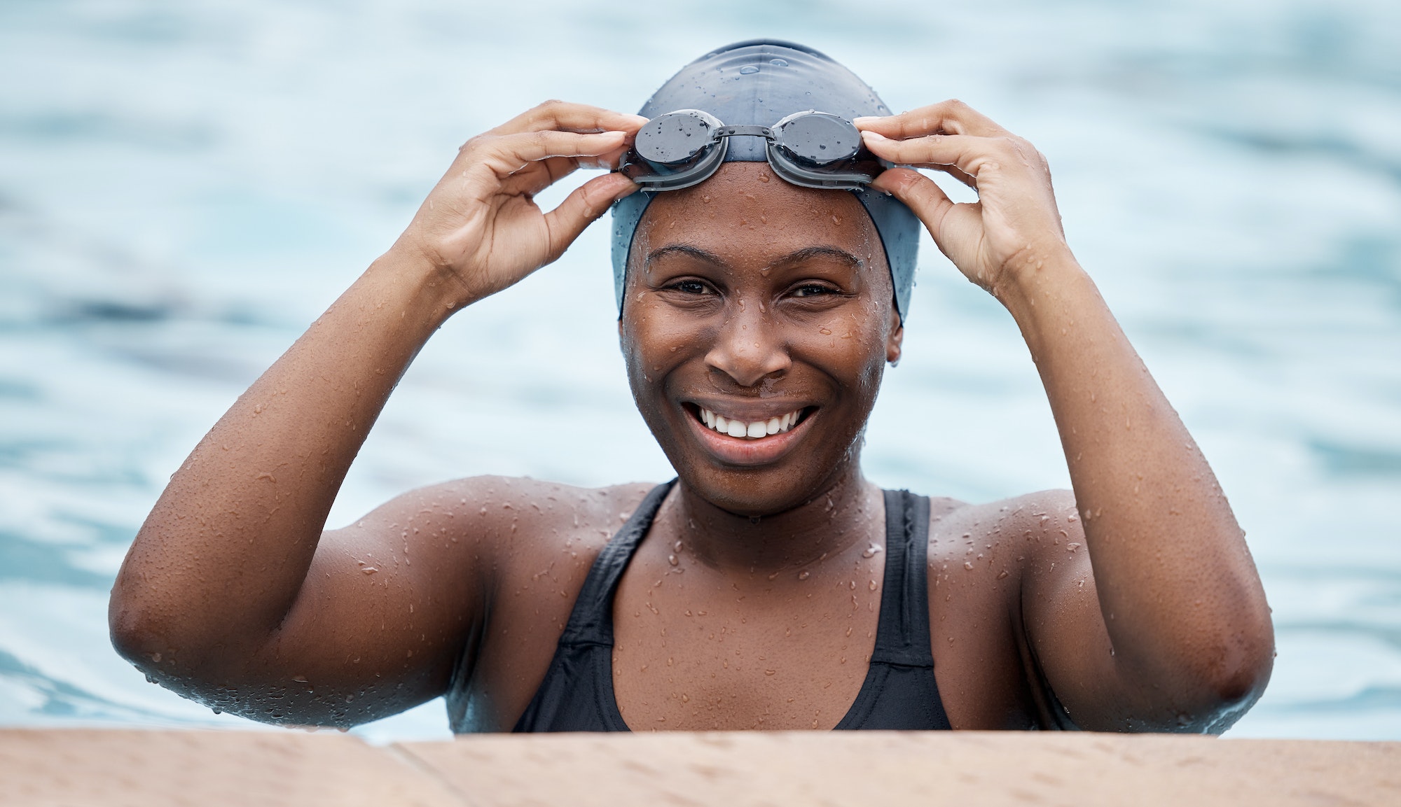 Training, portrait or happy black woman in swimming pool or water for practice, workout or body fit